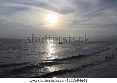 Santa Monica beach, 2019, late afternoon view of sea, with boat