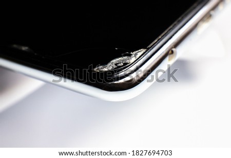 Broken phone close up photo. Damaged smartphone.