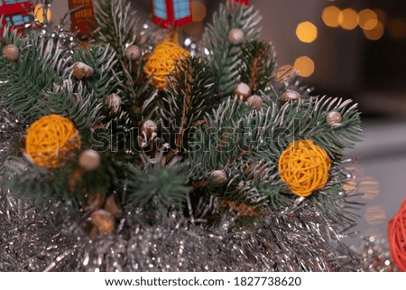 Christmas decor. tree branch and new years toys, wicker balls and tinsel. Template card and Copy space.