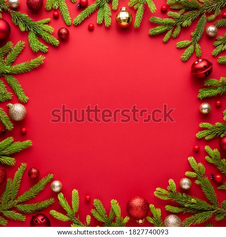 Christmas card with round frame on red background. Festive border with copy space for advertising text. Top view, flat lay
