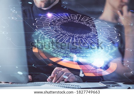 Multi exposure of data internet theme hologram with man working on computer on background. Concept of innovation.