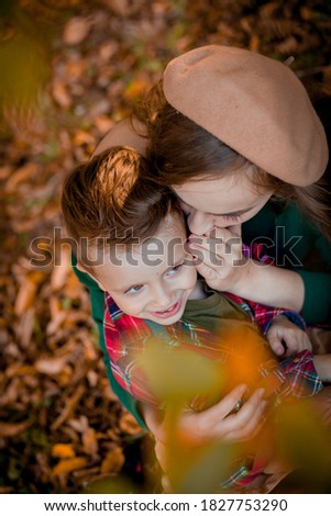Happy young mother playing and having fun with her little baby son on sunshine warm autumn day in the park. Happy family concept, Mother's Day .