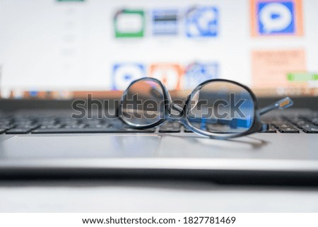 Work from home, View eye glasses above laptop computer that application desktop in business workplace office work desk