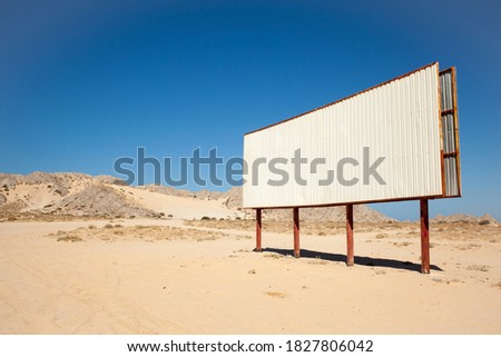 Blank billboard in a deserted landscape