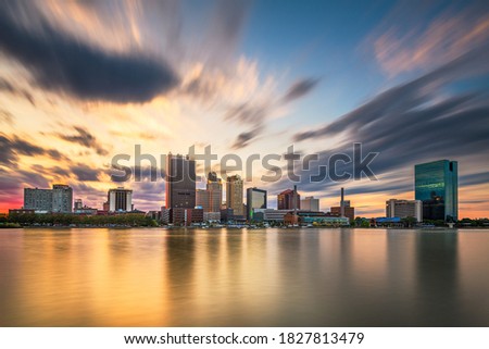 Toledo, Ohio, USA downtown skyline on the Maumee River at dusk. Royalty-Free Stock Photo #1827813479