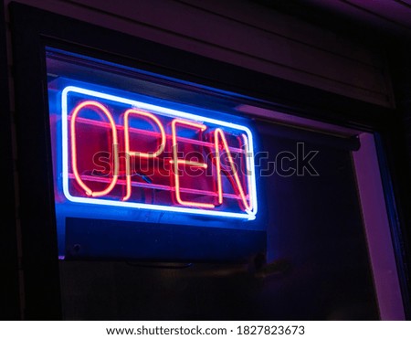 Neon open sign on business with space for copy