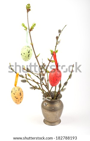  tree branches grow in spring and easter eggs hanging on background isolated on white