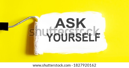 Ask Yourself .One open can of paint with white brush on it on yellow background. Royalty-Free Stock Photo #1827920162