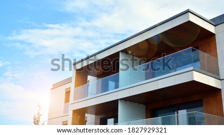 Estate property and condo architecture. Fragment of modern residential flat with apartment building exterior. Detail of new luxury home complex.  Royalty-Free Stock Photo #1827929321