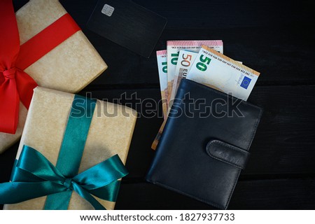 Christmas online shopping top view with money and wallet, gift box. High quality photo