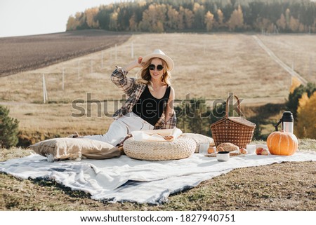 blonde woman resting in nature alone. A picnic alone. Communication at a distance. Nice view from the mountain. High quality photo