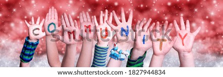 Children Hands Building Word Community, Red Christmas Background