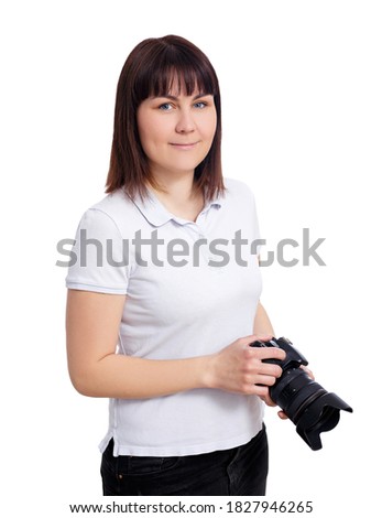 portrait of female photographer or videographer with modern dslr camera isolated on white background