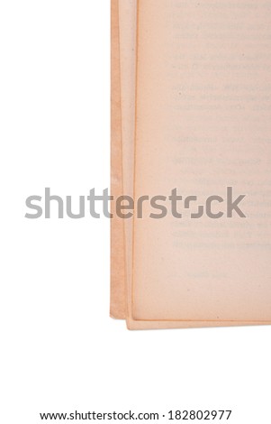 Close up view of open book corner, isolated on white background.