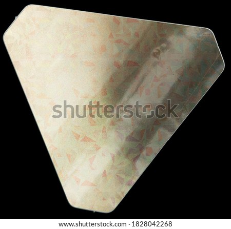 triangular shiny paper sticker with cool holographic color surface on real paper sheet isolated on black background. macro photo of nice holo sticker. just add your text here.