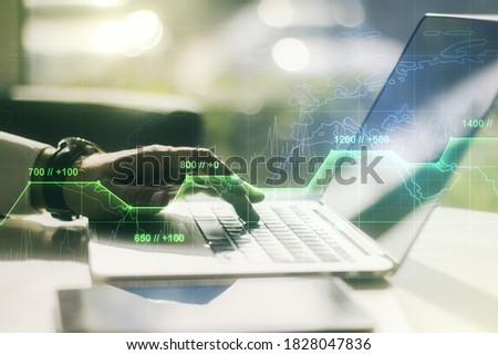 Abstract creative stats data concept with hands typing on laptop on background. Multiexposure