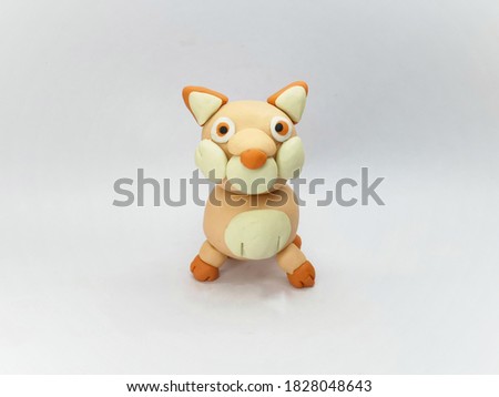 Front view of Plasticine statue 
wolf character on a white background.