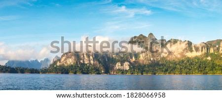 Panorama of Beautiful nature at Cheow Lan lake, Ratchaprapha Dam, Khao Sok National Park in Thailand in a summer day Royalty-Free Stock Photo #1828066958