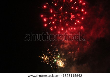 fireworks salute on a black background holiday new year Christmas white red flashes