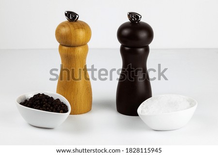 salt and pepper in white dip bowls