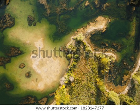 An aerial shot of a lake and landscape
