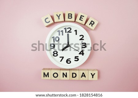 Cyber Monday with clock on pink background