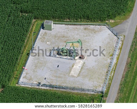                 
Aerial view of pumpjack at oil field at the Dutch German border near Emlichheim and Schoonebeek.