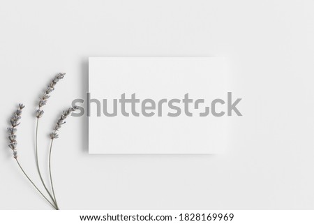White invitation card mockup with a lavender. 5x7 ratio, similar to A6, A5.