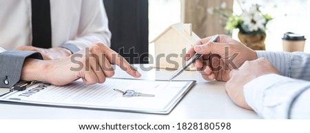 Estate agent broker reach contract form and presentation to client signing agreement contract real estate with approved mortgage application form, buying mortgage loan offer for and house insurance.