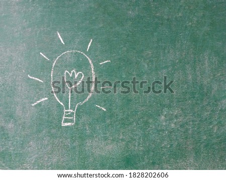 light bulb line on chalkboard background.sign or symbol of idea and think concept.