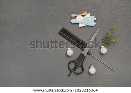 Christmas composition. Hairdressing tools on a gray background. Template for a postcard or information about a hair salon. Flat lay, copy space.