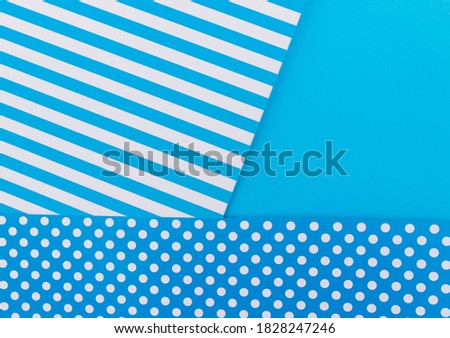Texture background of fashionable papers in the geometry style. Paper on a blue background. Color bright background.