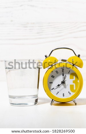 morning glass of pure water, conceptual photo on white background, vertical photo