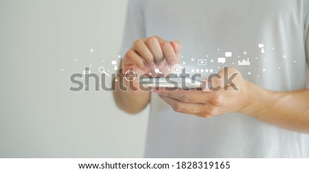 close up man hand using smartphone to use search engine optimization (SEO) tools for finding customer or promote and advertise about content online for marketing technology and business concept Royalty-Free Stock Photo #1828319165