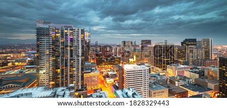 Denver, Colorado, USA downtown cityscape rooftop view at dusk.