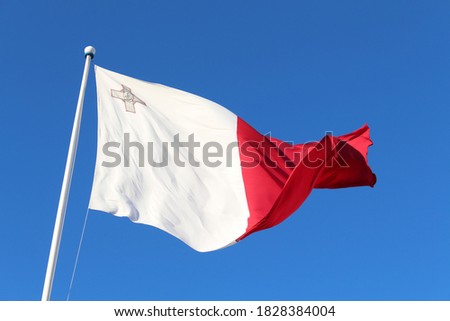 The Maltese flag flying high on a nice sunny day in Malta during summer