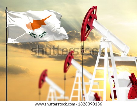 Oil rigs against the backdrop of the colorful sky and a flagpole with the flag of Cyprus. The concept of oil production, minerals, development of new deposits.