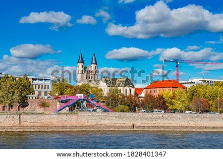 Ancient two towers of Church Monastery of Our Beloved Woman (Kloster Unser Lieben Frauen) in historical downtown of Magdeburg at blue sky with funny clouds in early Autumn, Germany, details