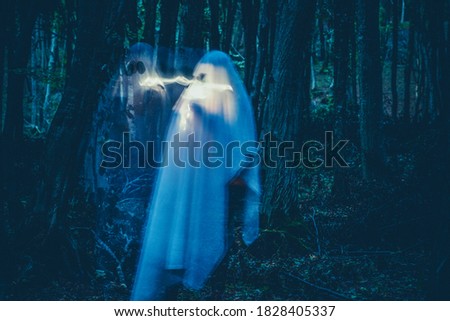 ghost in a dark forest Halloween background 