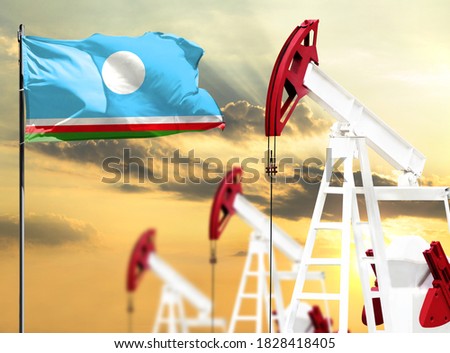 Oil rigs against the backdrop of the colorful sky and a flagpole with the flag of Sakha Republic. The concept of oil production, minerals, development of new deposits.