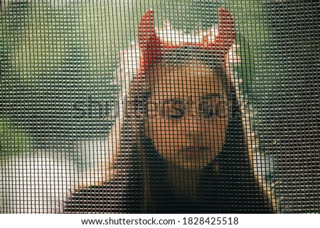 little girl in costumes for Halloween celebration. Halloween party, photo of Halloween characters. Autumn teenager portrait