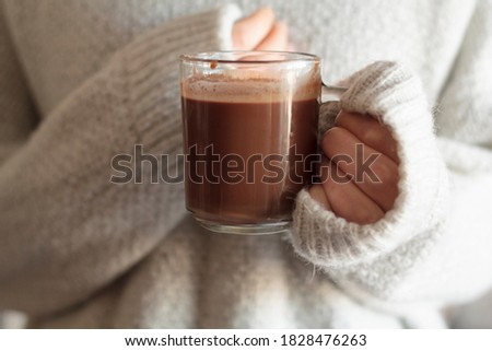 Girl holding a cup of hot chocolate