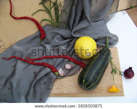 zucchini, pepper, garlic, flowers, onion, grey cloth