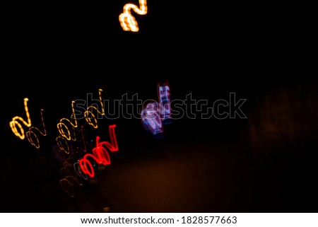 Abstract night lights background,Colorful lights of urban city surrounding moving and blurred by motion