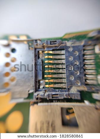 sd card reader on white background.this is a picture of a card reader on motherboard of a mobile phone.