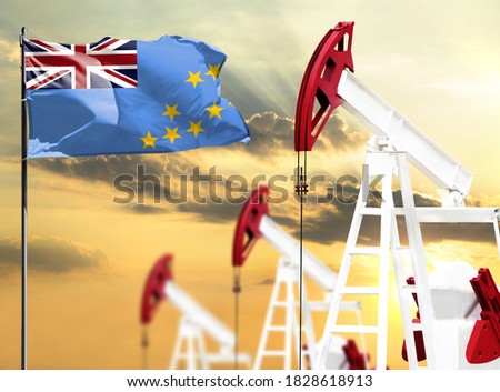 Oil rigs against the backdrop of the colorful sky and a flagpole with the flag of Tuvalu. The concept of oil production, minerals, development of new deposits.