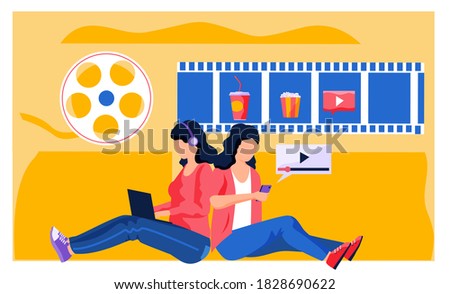 A woman in headphones sits with a laptop in her hands and chooses food and a movie to watch on the computer. Girl with phone is watching video. Online cinema. Watching movie on the internet