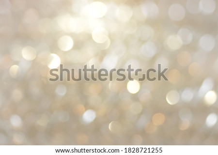 blur glitter, bokeh, defocused gold festive background,  texture. Xmas abstract backdrop neutral color .