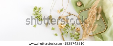 Dried flowers and herbs for making decoration flat lay banner on white background. Framing dried plants. Top view.  Copy space.Hobby handmade with flowers.