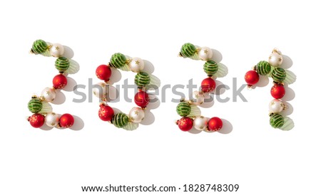 Happy New year 2021 celebration. Gold, green and red balls numeral 2021 isolated on a white background. Flat lay. Banner, greeting card, invitation. Christmas balls. horizontal